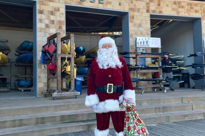 a person walking down a sidewalk in front of a building