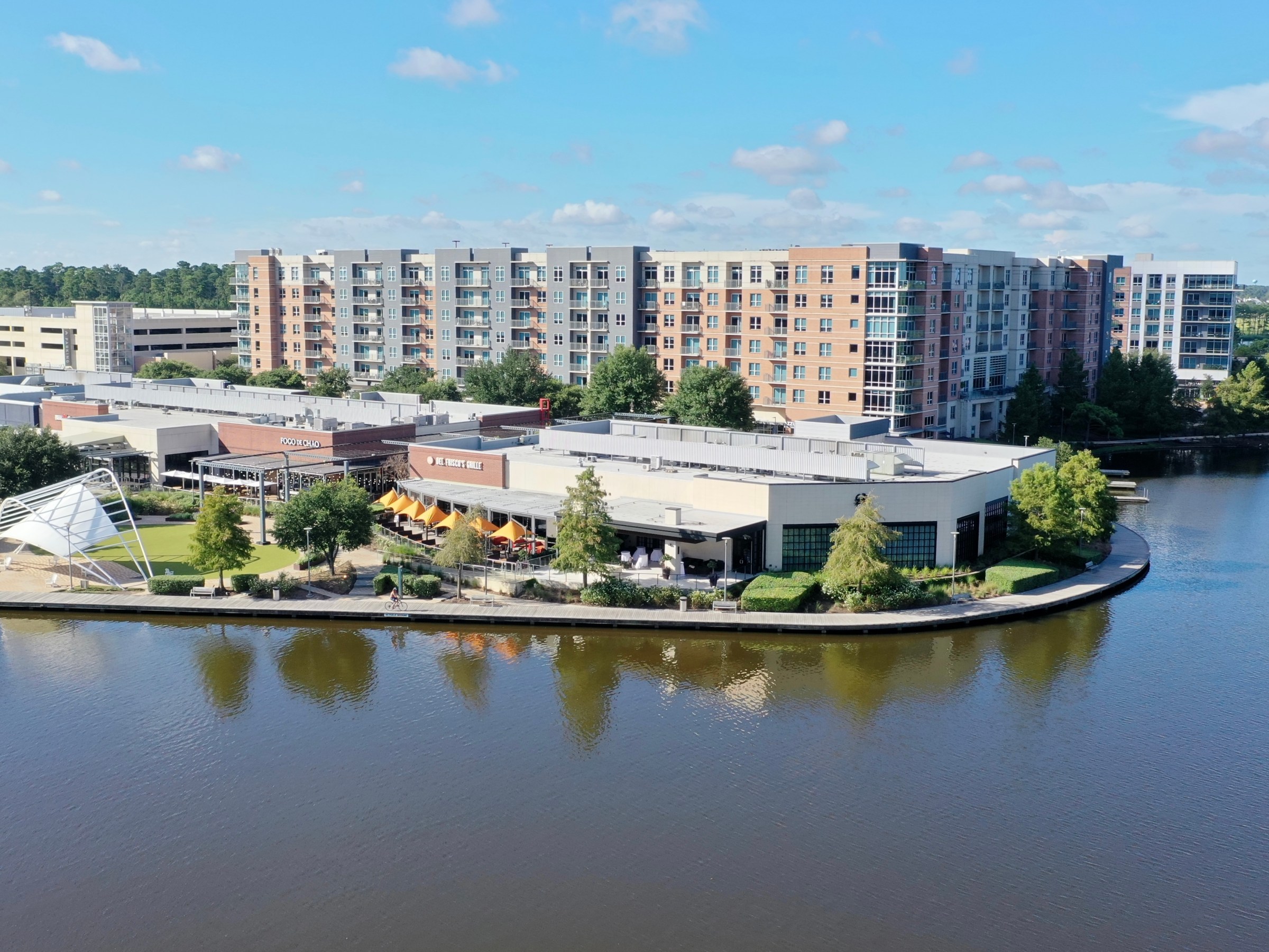 a large body of water with a city in the background