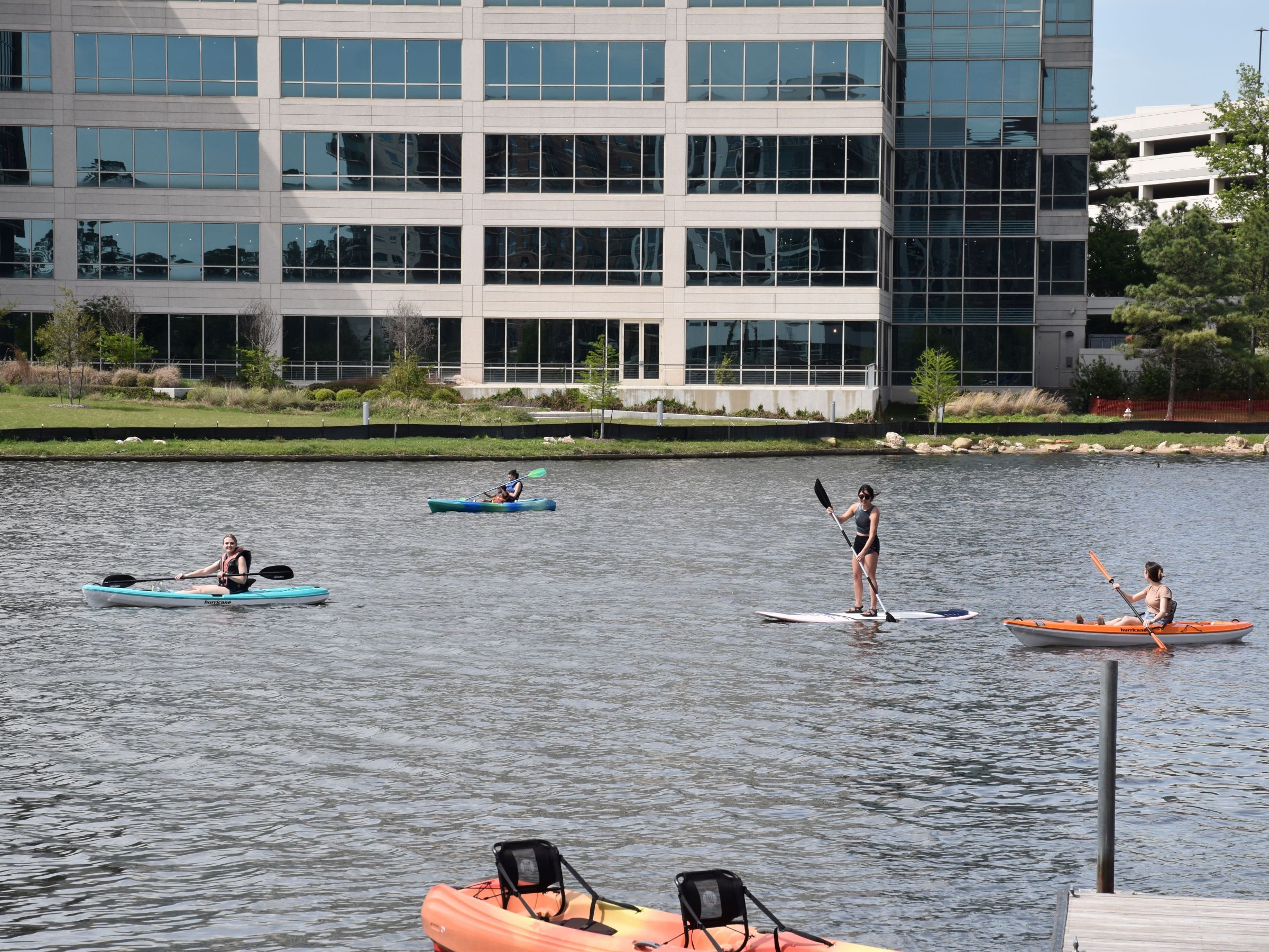 a group of people in a boat on a body of water