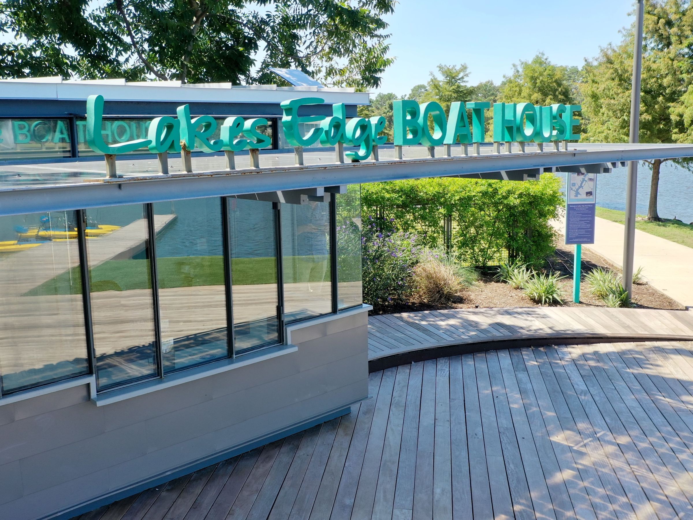 a train is parked on the side of a fence