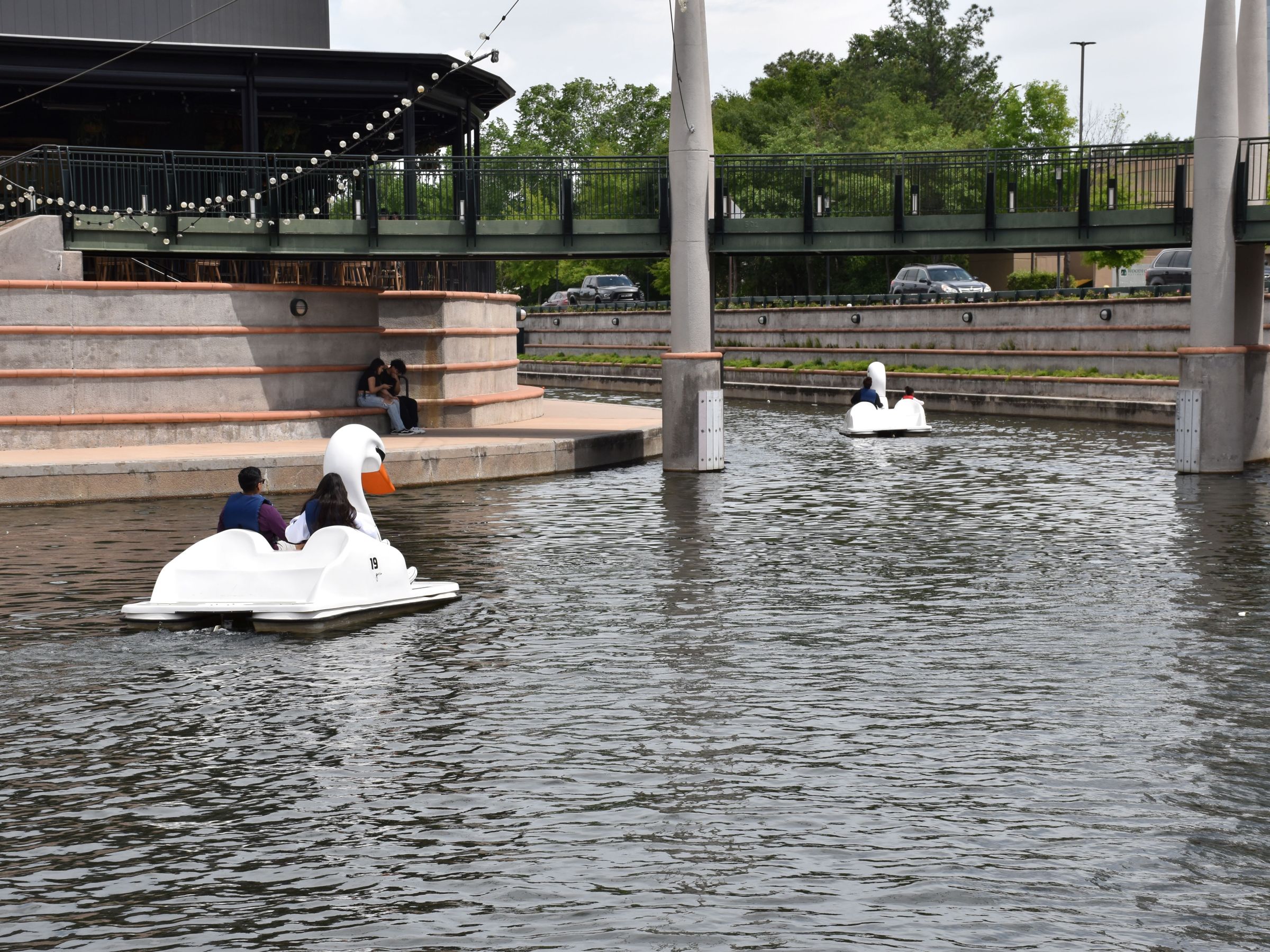 a person sitting next to a body of water
