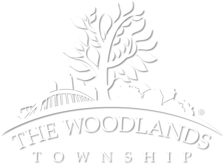 Embossed logo of The Woodlands Township with tree and bridge.